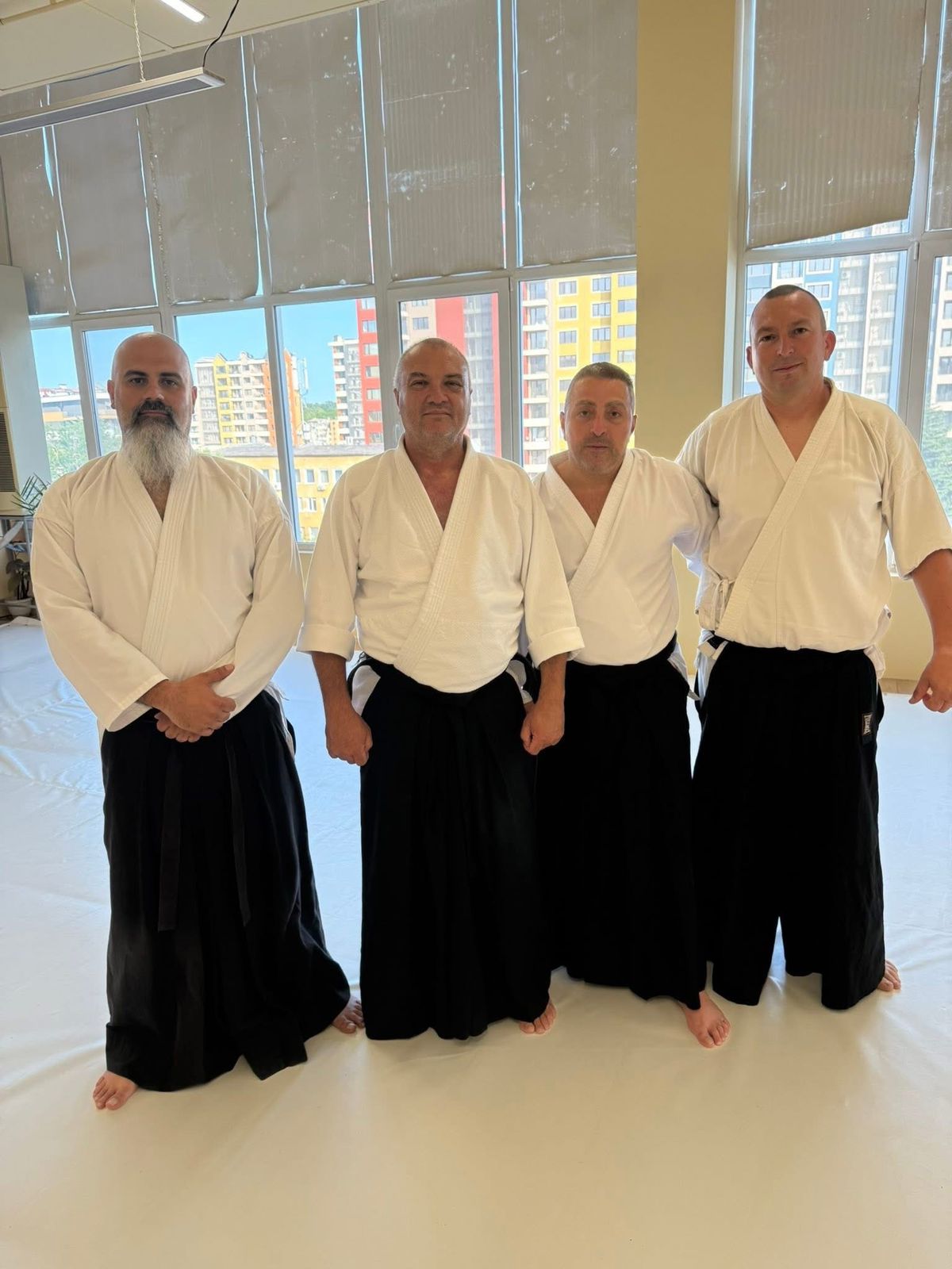 Instructors in hakama at a seminar dojo